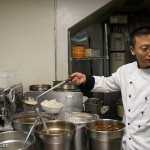 Tony Hu serving soup